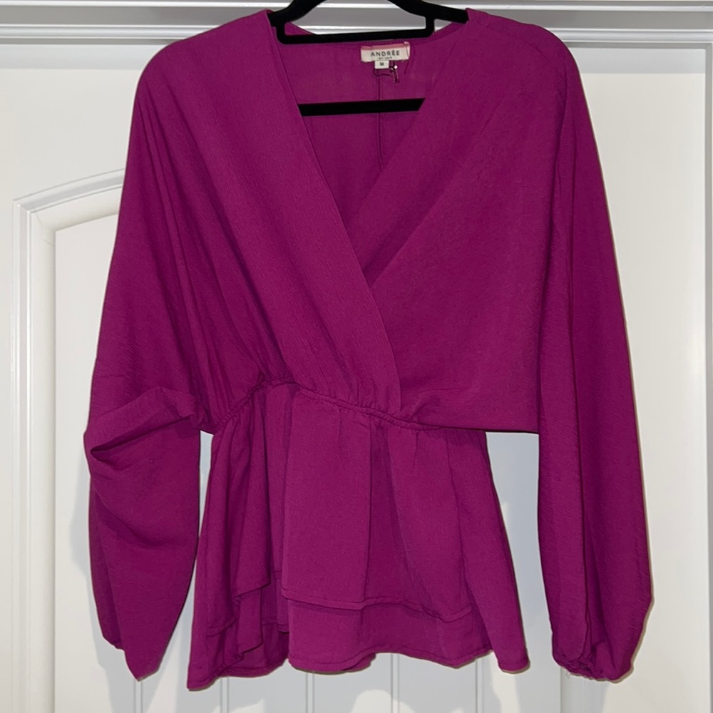 Size medium blouse, magenta from a local boutique.